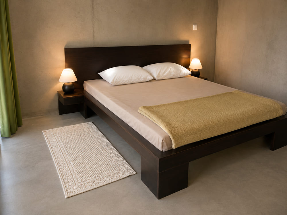 Dark wenge platform bed with matching wall-mounted floating bedside tables