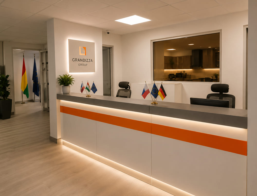 Wide office reception counter in white with an orange inlay stripe and LED under-lighting